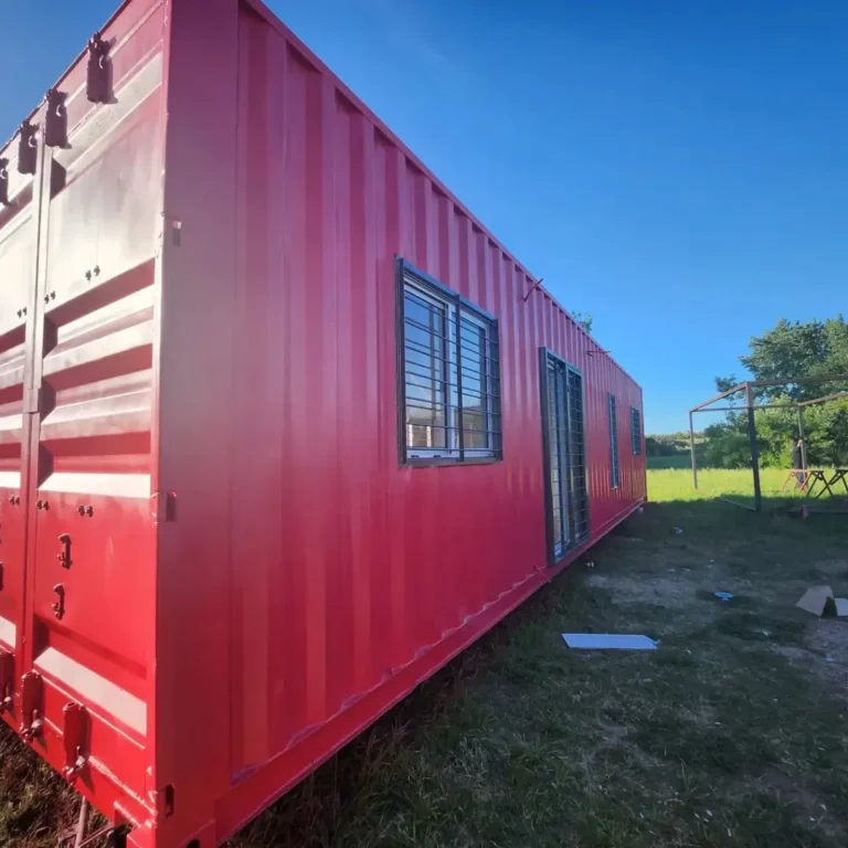 Exterior of a container house painted with red color
